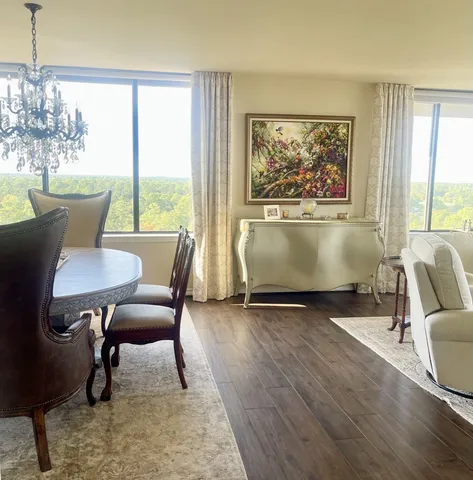a view of a dining room with furniture window and outside view