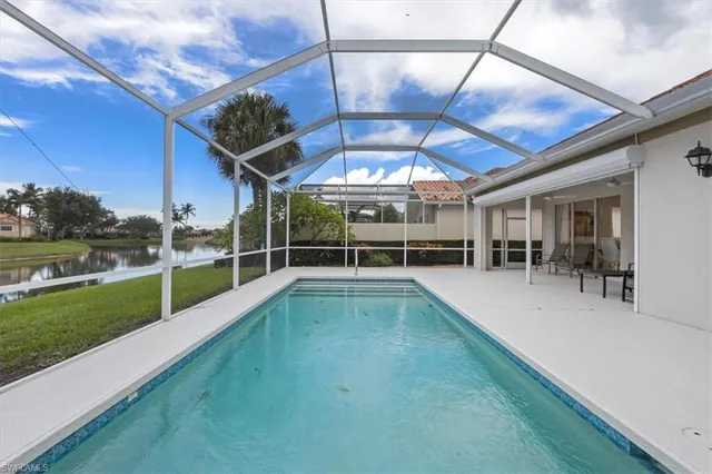 a view of a lake with houses in the background