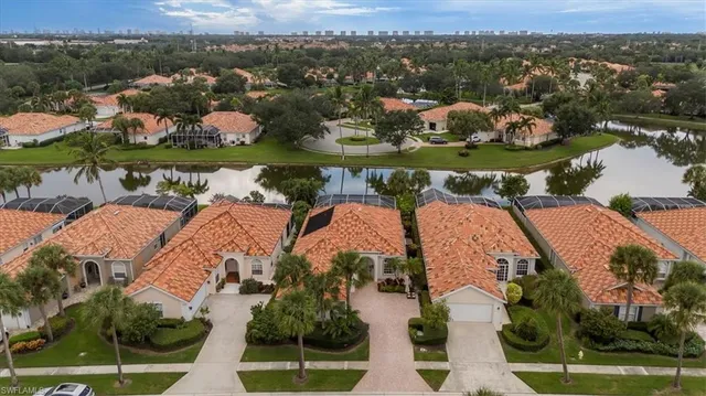 an aerial view of a houses with outdoor space and lake view