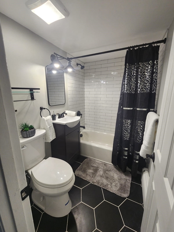 99 Cluff Crossing Road, Unit B12 Salem, NH 03079 - Photo 12 of 12 a bathroom with a sink toilet and shower