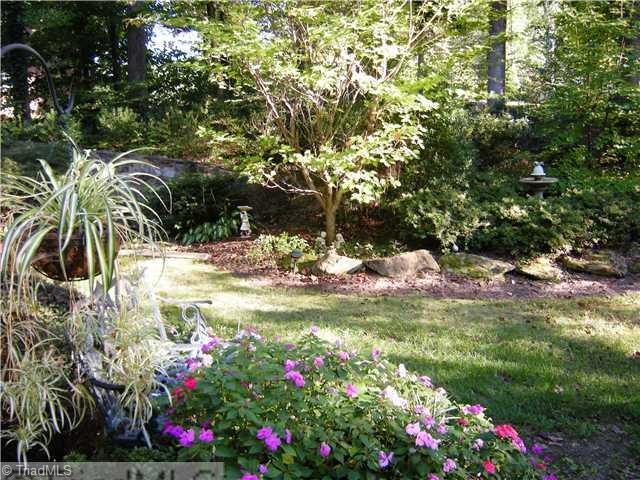 1812 Wild Fern Drive Oak Ridge, NC 27310 - Photo 12 of 14 Exterior Front. The gardens are amazing, yet very natural. This yard is filled with Dogwoods, Japanese Maples, Azaleas, rhododendrons, Hosta and much more. Stone and Brick walls, specialty lighting, and concrete garden walks!