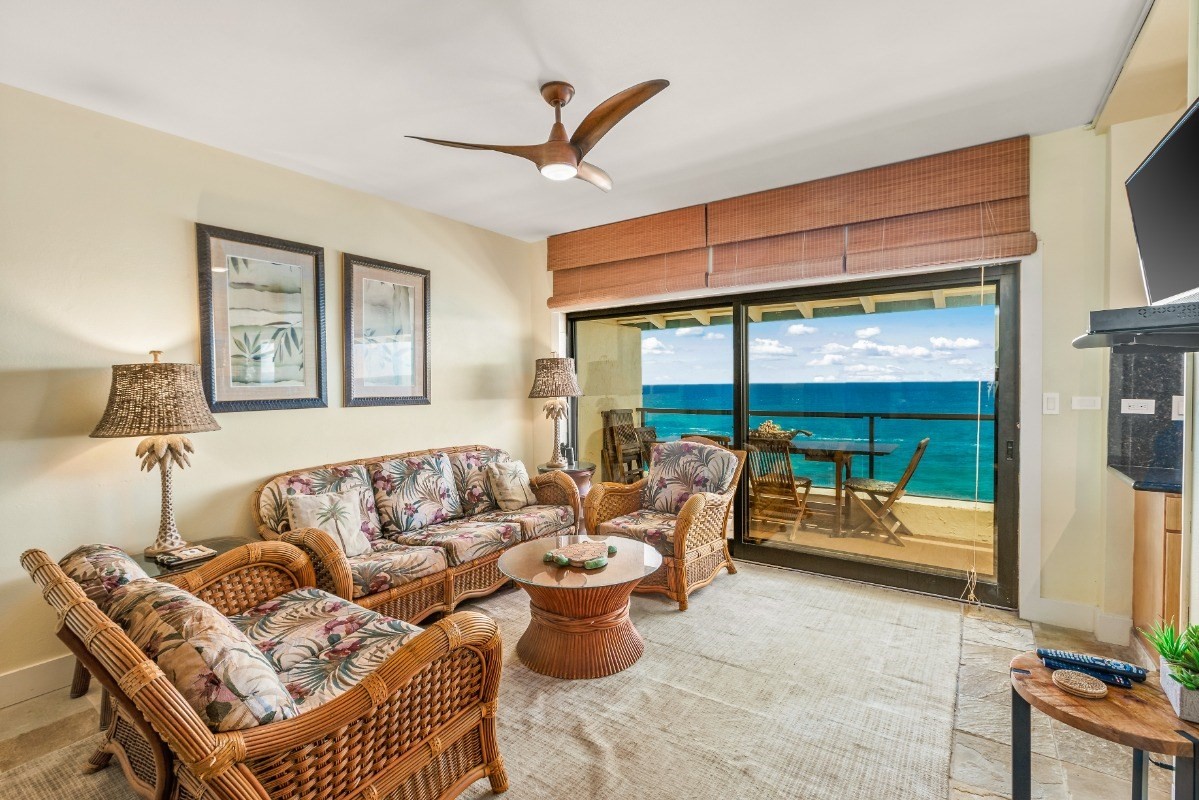 1775 Pe'e Road, Unit B302 Koloa, HI 96756 - Photo 5 of 16 a living room with furniture and a large window