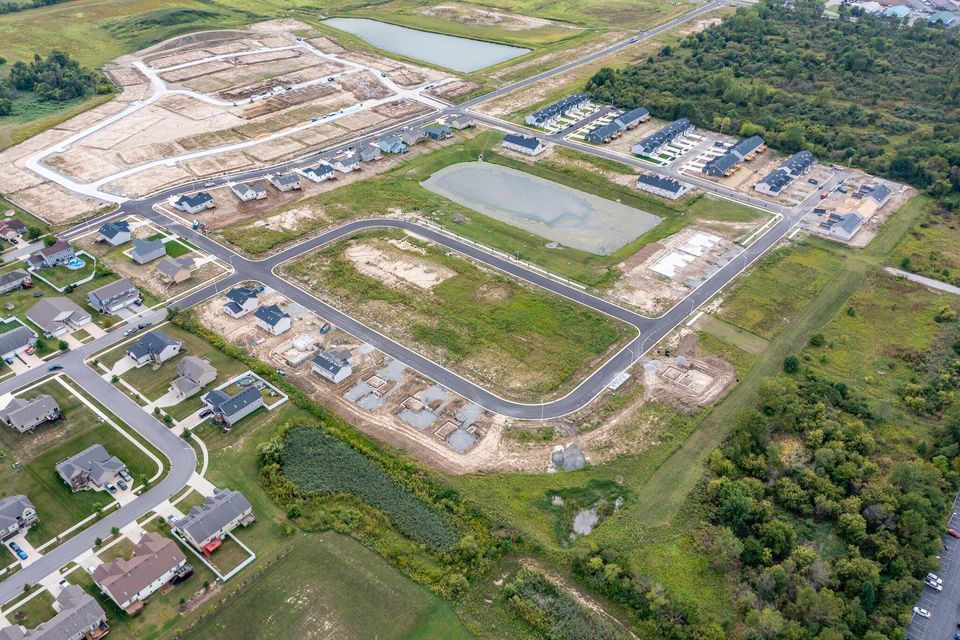 8239 Maximillian Lane Merrillville, IN 46410 - Photo 3 of 4 an aerial view of a residential houses with outdoor space