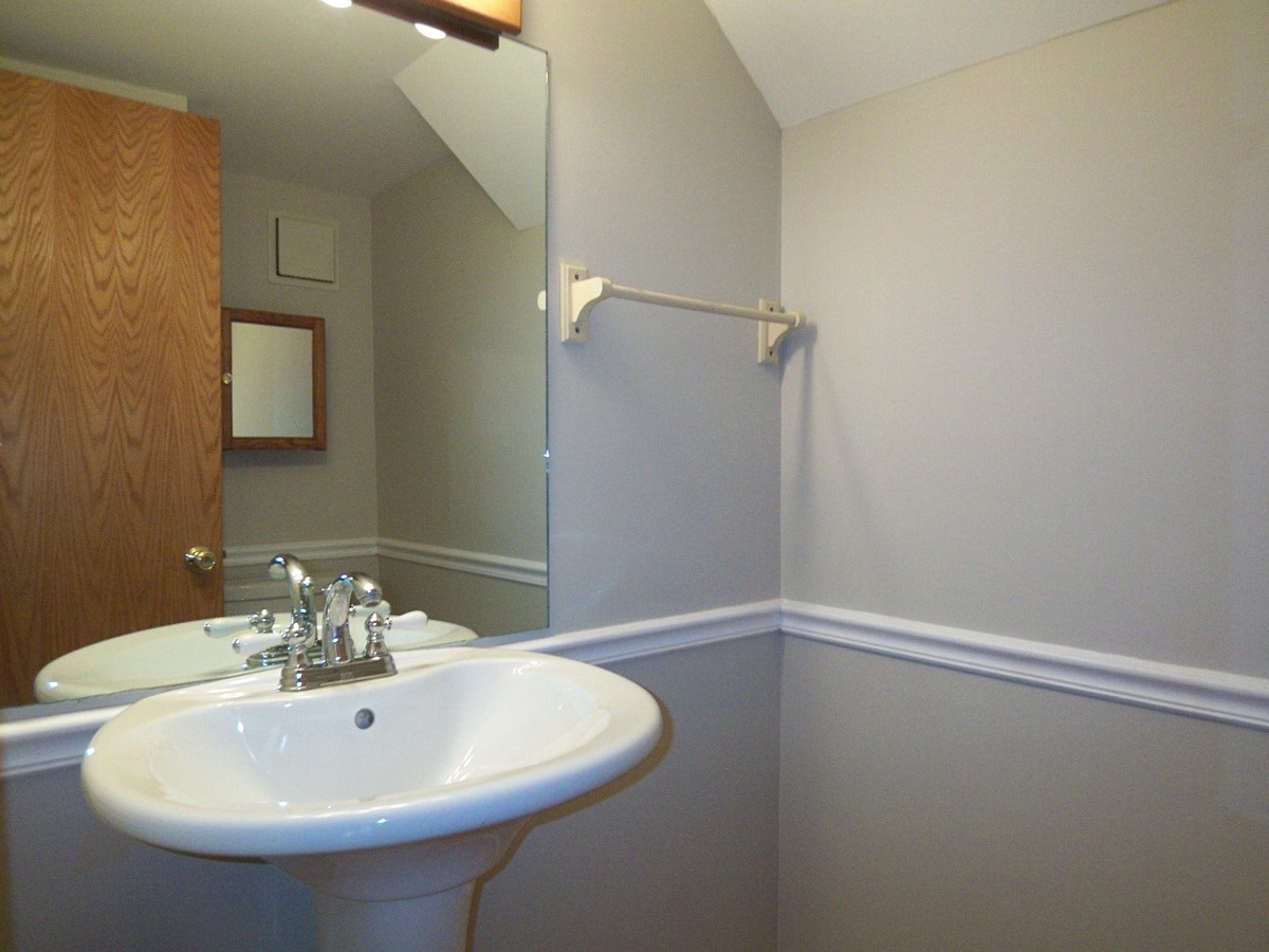 249 Nantucket Harbor Schaumburg, IL 60193 - Photo 13 of 26 a bathroom with a sink and a mirror