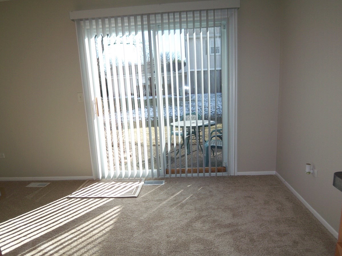 249 Nantucket Harbor Schaumburg, IL 60193 - Photo 15 of 26 an empty room with wooden floor and windows