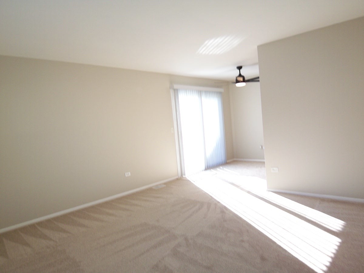 249 Nantucket Harbor Schaumburg, IL 60193 - Photo 4 of 26 an empty room with a empty space and windows