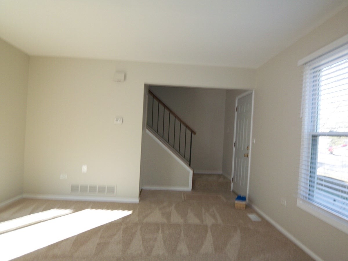 249 Nantucket Harbor Schaumburg, IL 60193 - Photo 5 of 26 a view of an empty room with a window