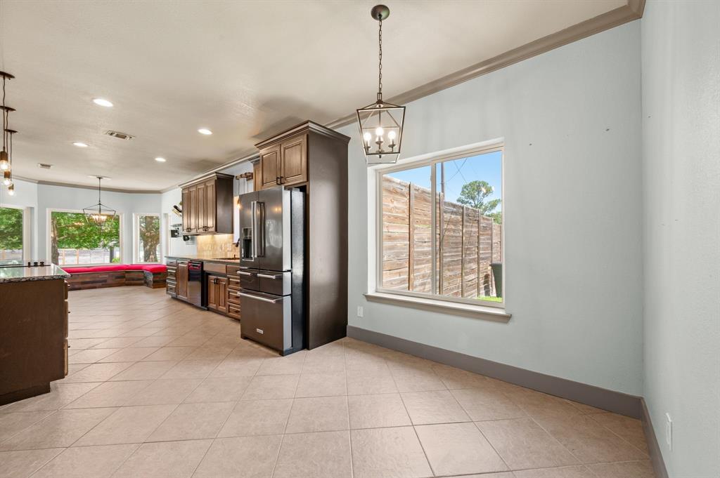 508 Chandler Road Keller, TX 76248 - Photo 38 of 39 This open floor plan is spacious and airy. The French door refrigerator conveys with the home. Sparkling energy efficient windows were added throughout the home in 2018.