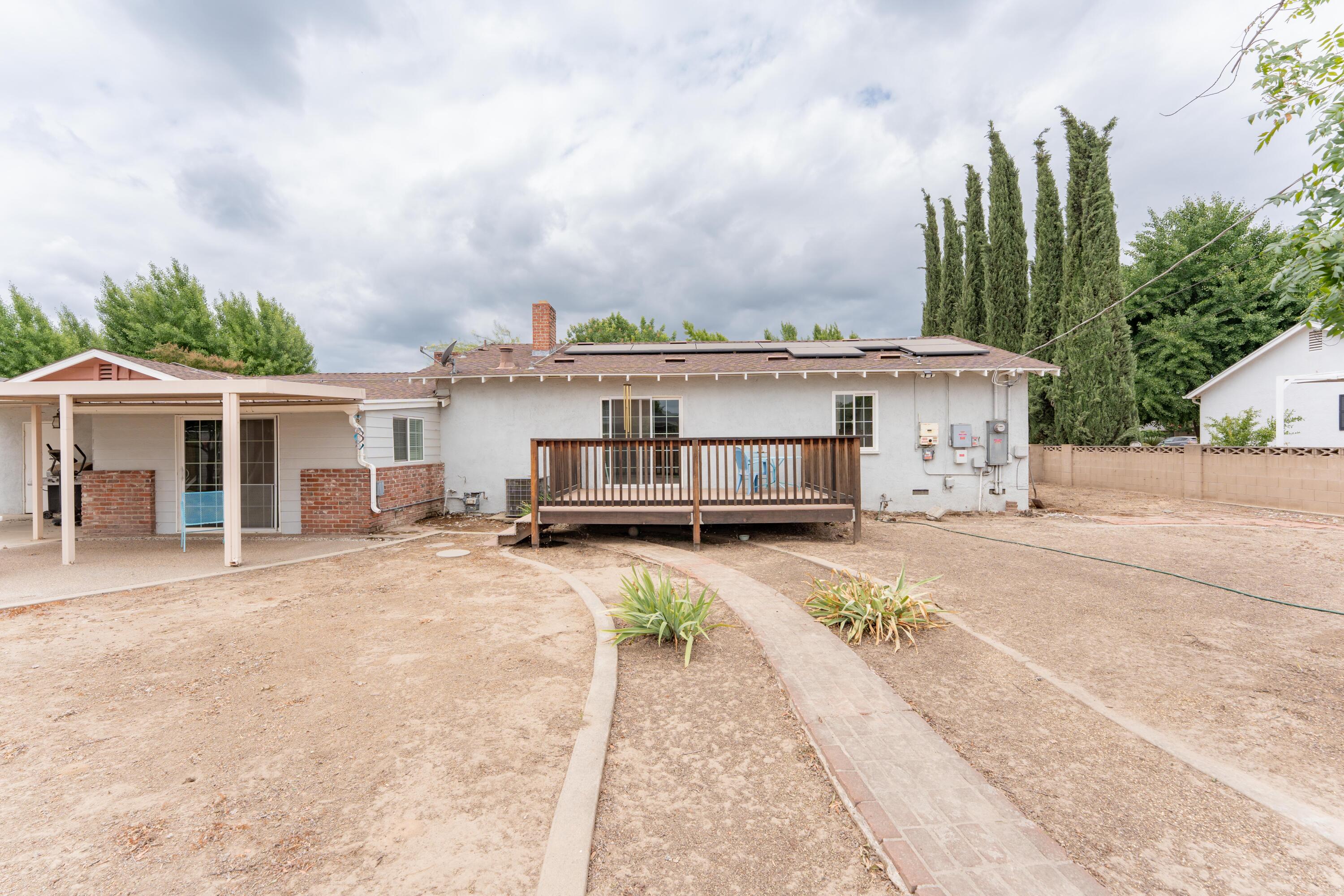 570 North Birch Avenue Reedley, CA 93654 - Photo 44 of 52 a view of a white house with a large space in front of it