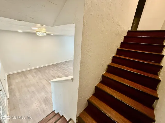 a view of entryway with wooden floor