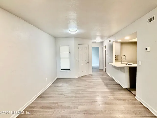 a view of a kitchen and a windows