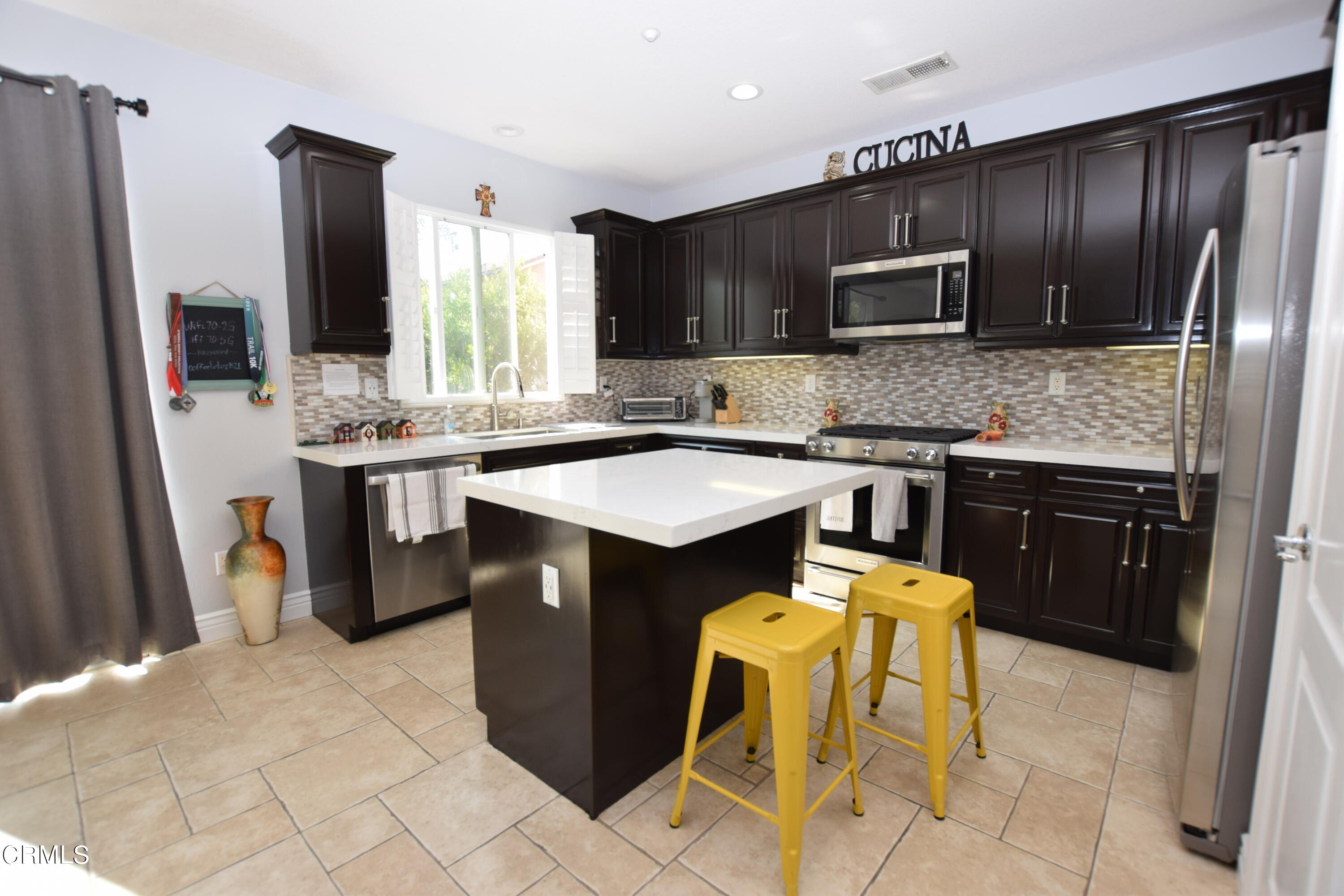 615 Halifax Lane Oxnard, CA 93035 - Photo 8 of 21 a kitchen with stainless steel appliances granite countertop a sink stove and refrigerator