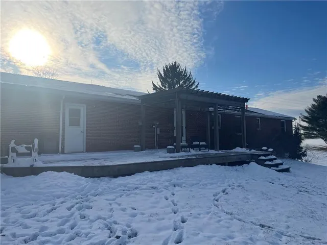 a view of a house with a yard and garage