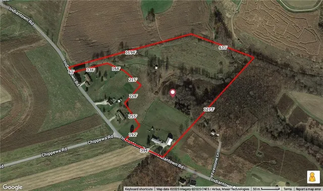 a view of a backyard of the house