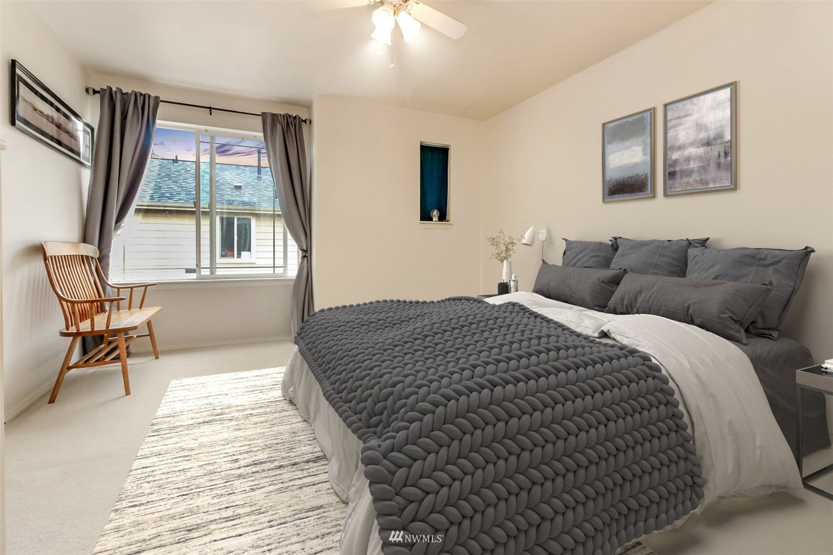 4632 Northeast 5th Court Renton, WA 98059 - Photo 14 of 23 a bedroom with a bed and a large window