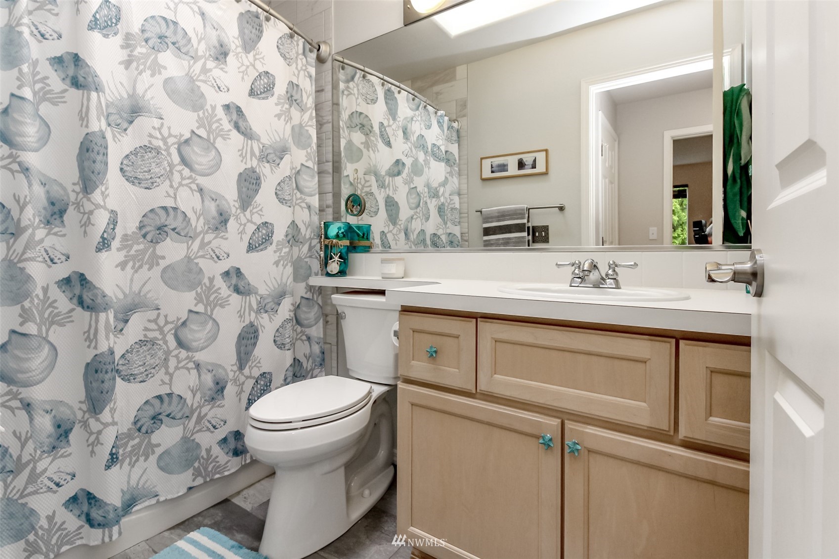 4632 Northeast 5th Court Renton, WA 98059 - Photo 18 of 23 a bathroom with a sink toilet and a mirror