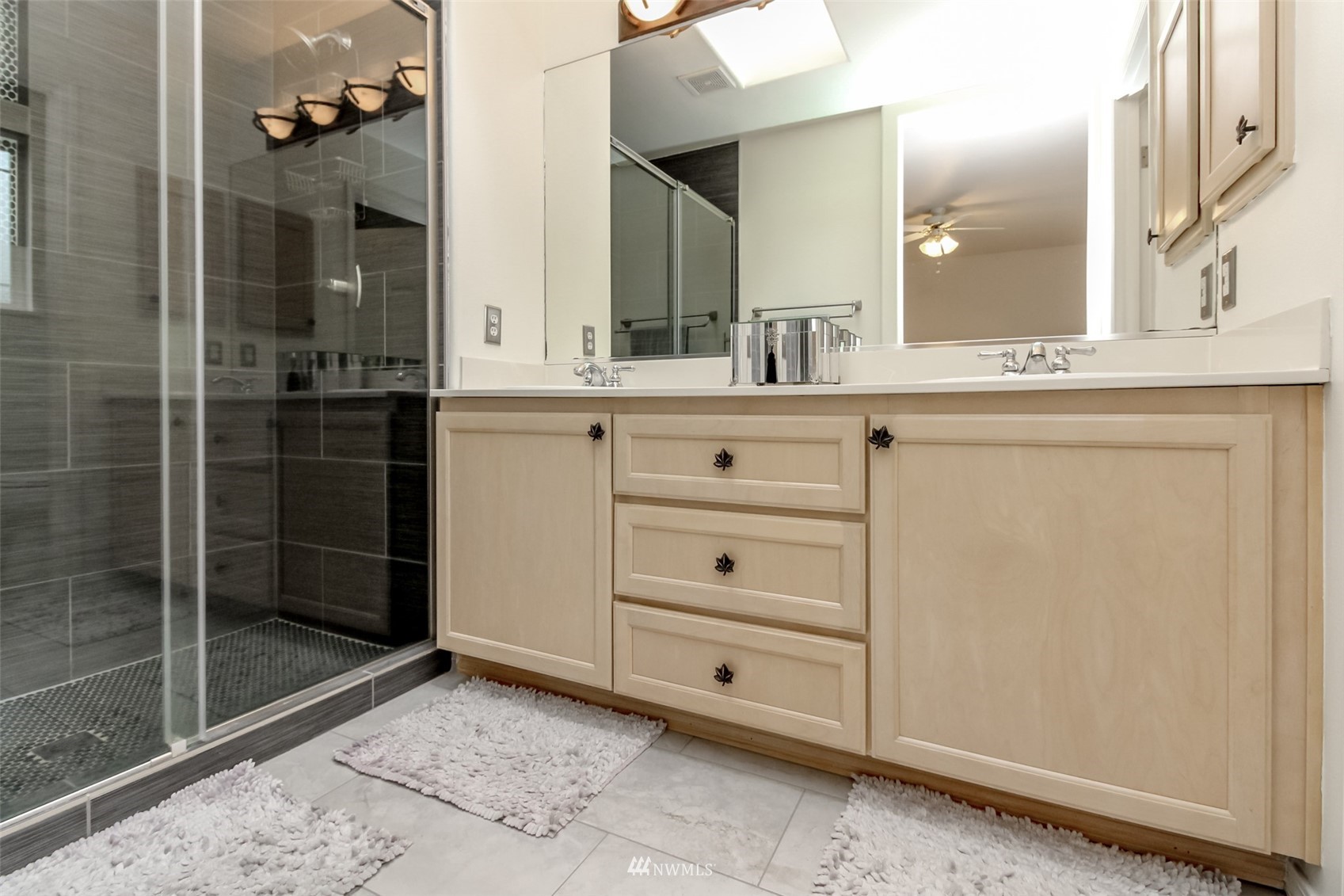 4632 Northeast 5th Court Renton, WA 98059 - Photo 19 of 23 a bathroom with a sink and a mirror