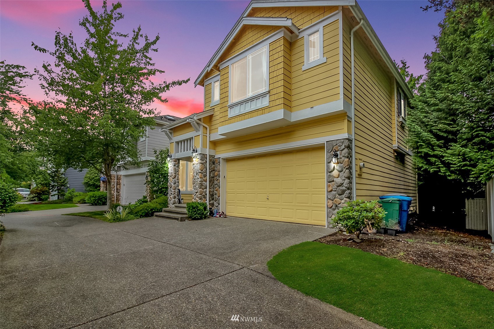 4632 Northeast 5th Court Renton, WA 98059 - Photo 2 of 23 a front view of a house with a yard and garage