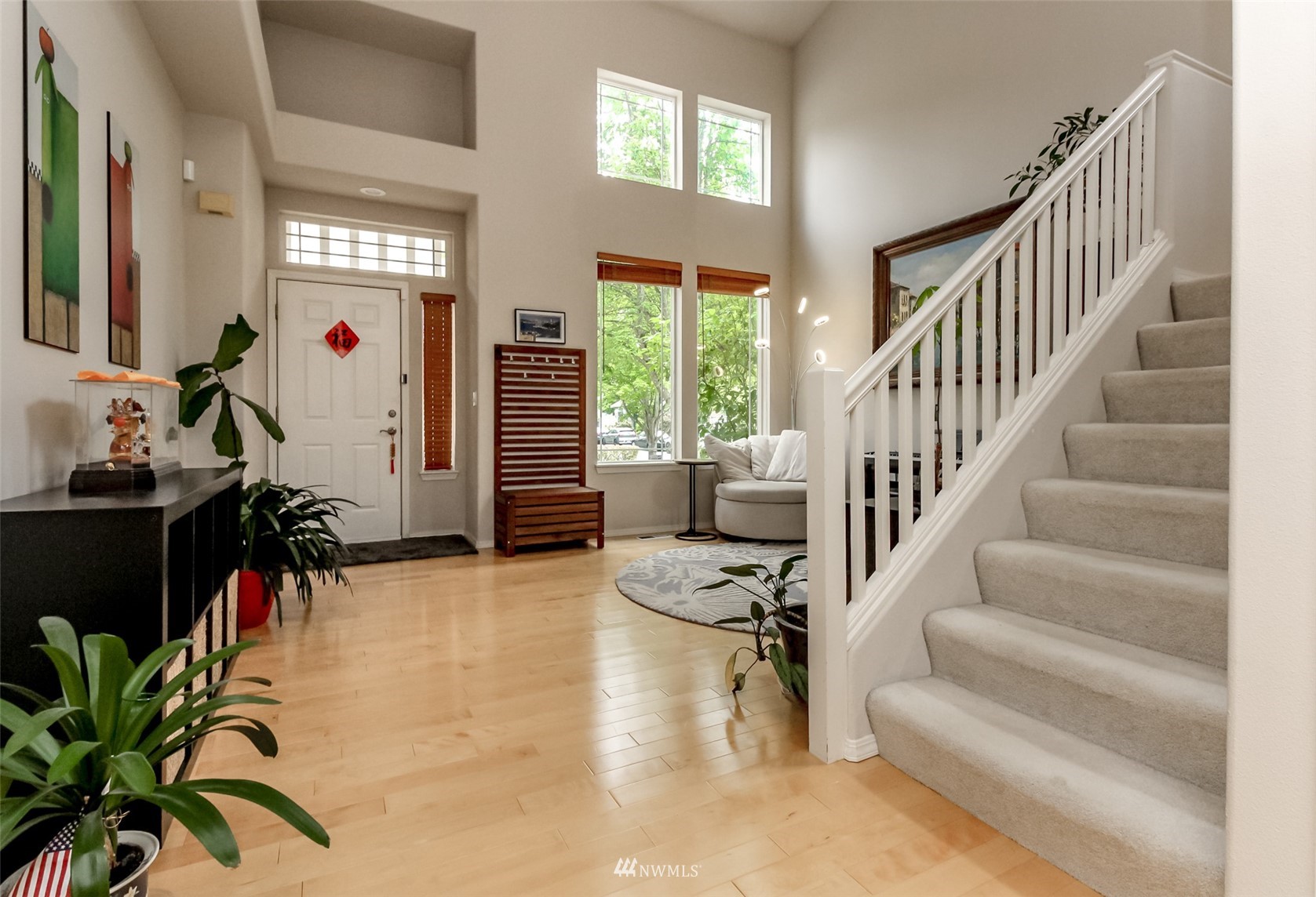 4632 Northeast 5th Court Renton, WA 98059 - Photo 4 of 23 a view of entryway and hall with wooden floor