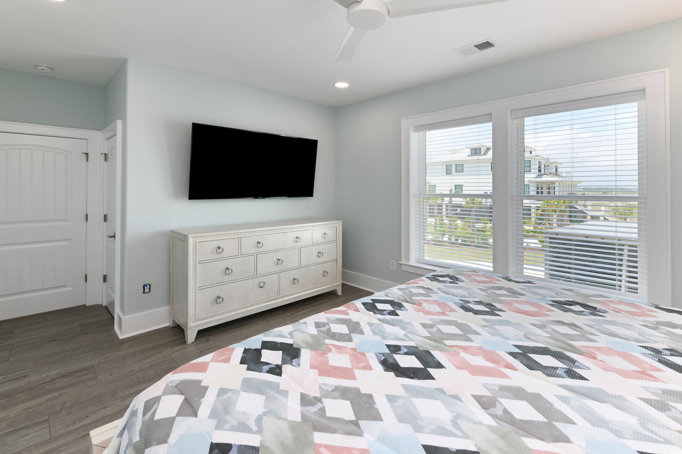 2349 South Waccamaw Drive Murrells Inlet, SC 29576 - Photo 19 of 39 Bedroom with visible vents, baseboards, ceiling fan, and dark wood finished floors