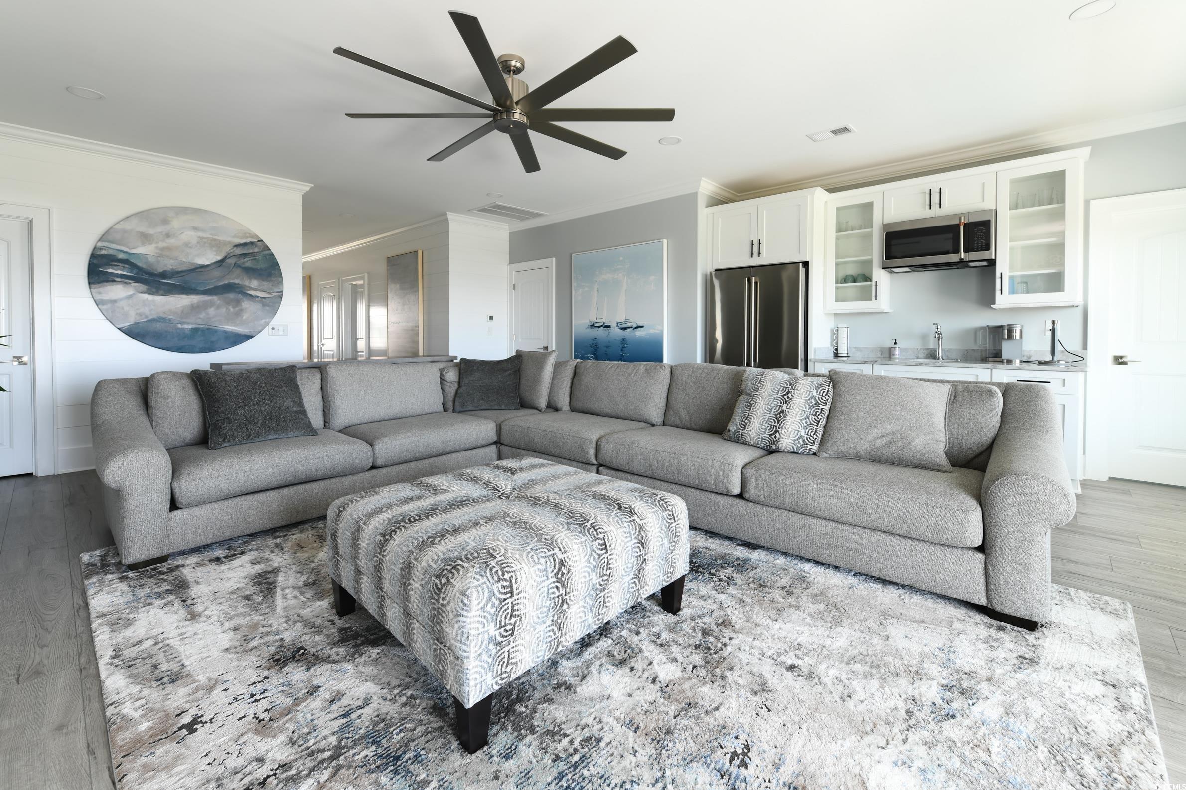 2349 South Waccamaw Drive Murrells Inlet, SC 29576 - Photo 26 of 39 Living room with wood finished floors, visible vents, ornamental molding, and ceiling fan