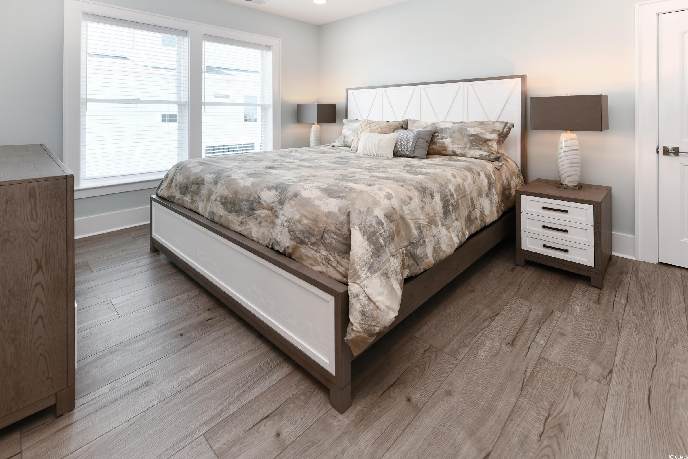 2349 South Waccamaw Drive Murrells Inlet, SC 29576 - Photo 28 of 39 Bedroom with baseboards and wood finished floors