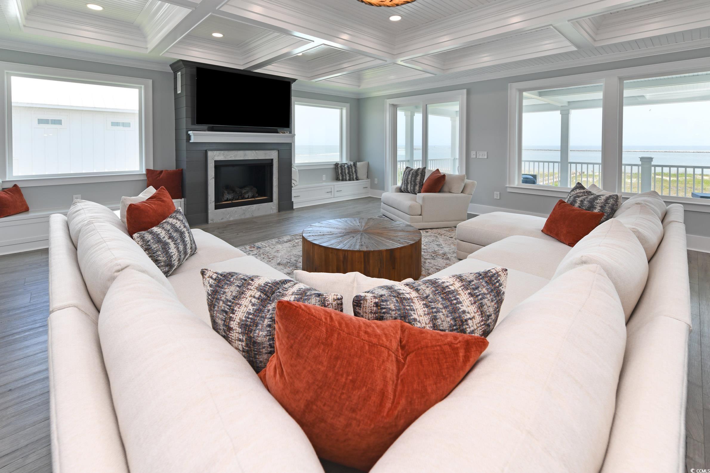 2349 South Waccamaw Drive Murrells Inlet, SC 29576 - Photo 7 of 39 Living room featuring coffered ceiling, crown molding, wood finished floors, and beam ceiling