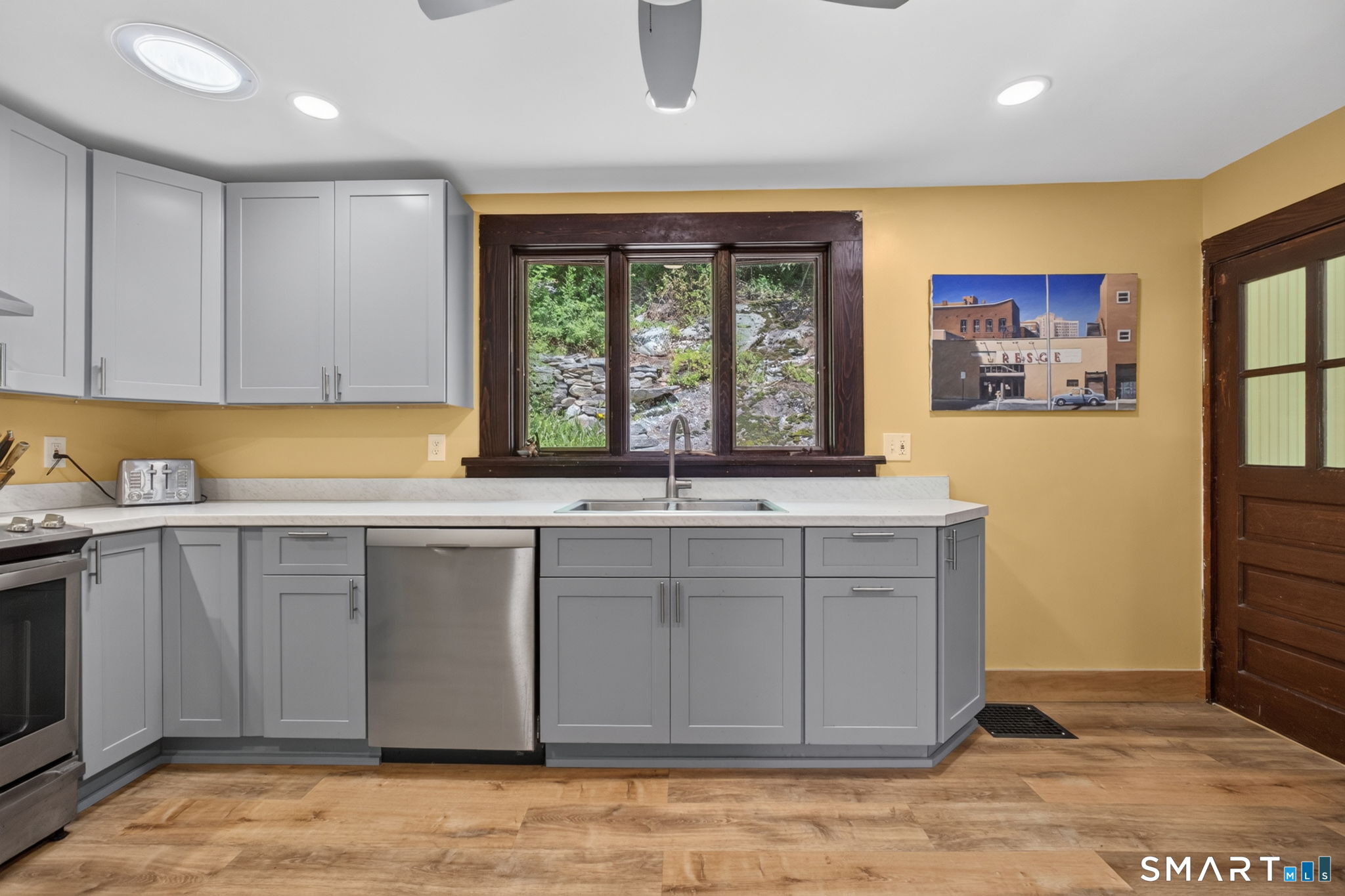 79 River Street Deep River, CT 06417 - Photo 16 of 40 a view of a kitchen with a sink cabinets and a window