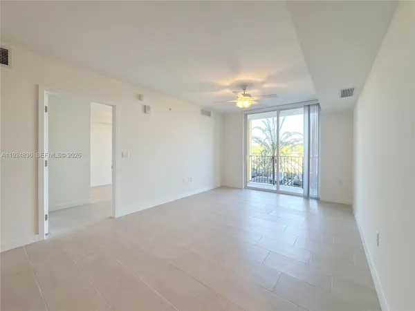 an aerial view of residential houses with yard