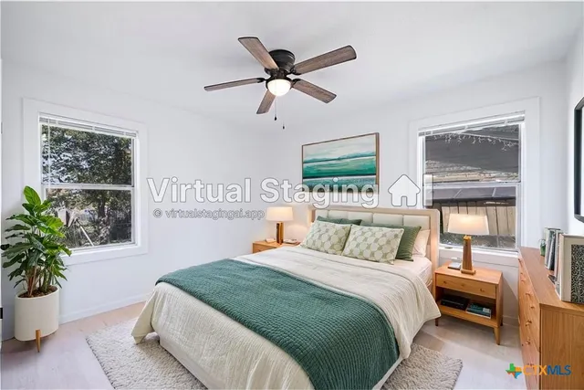 a bedroom with a bed and window