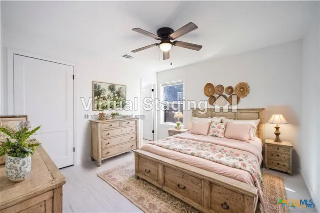 a bed room with a bed and a window