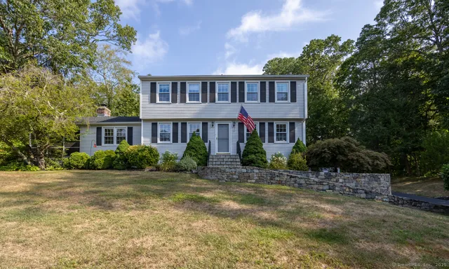 a view of a brick building next to a yard