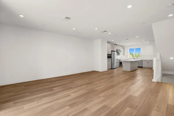 a kitchen with a sink cabinets and stainless steel appliances
