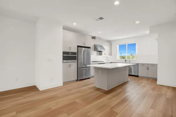 a sink with a window and vanity