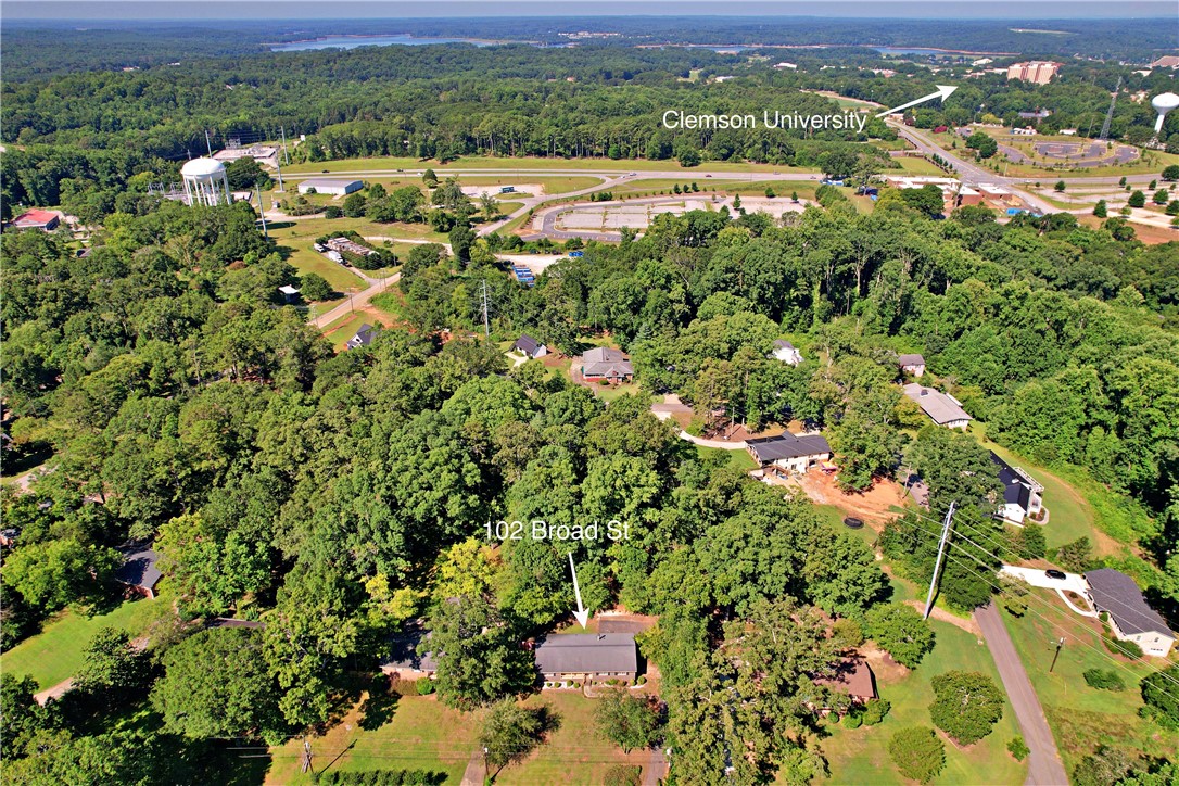 102 Broad Street Clemson, SC 29631 - Photo 38 of 40 An aerial perspective showcases a residential area nestled within a lush, green landscape, offering both privacy and connectivity.