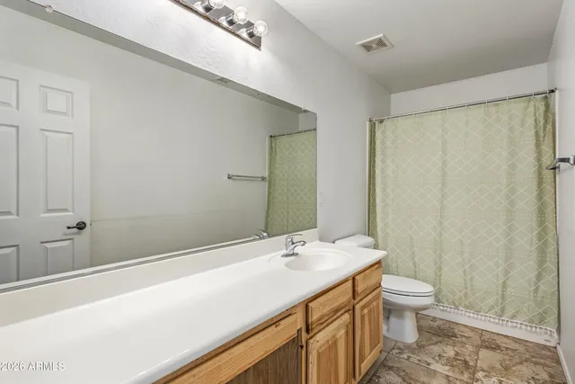 a kitchen with stainless steel appliances granite countertop a stove refrigerator sink and cabinets