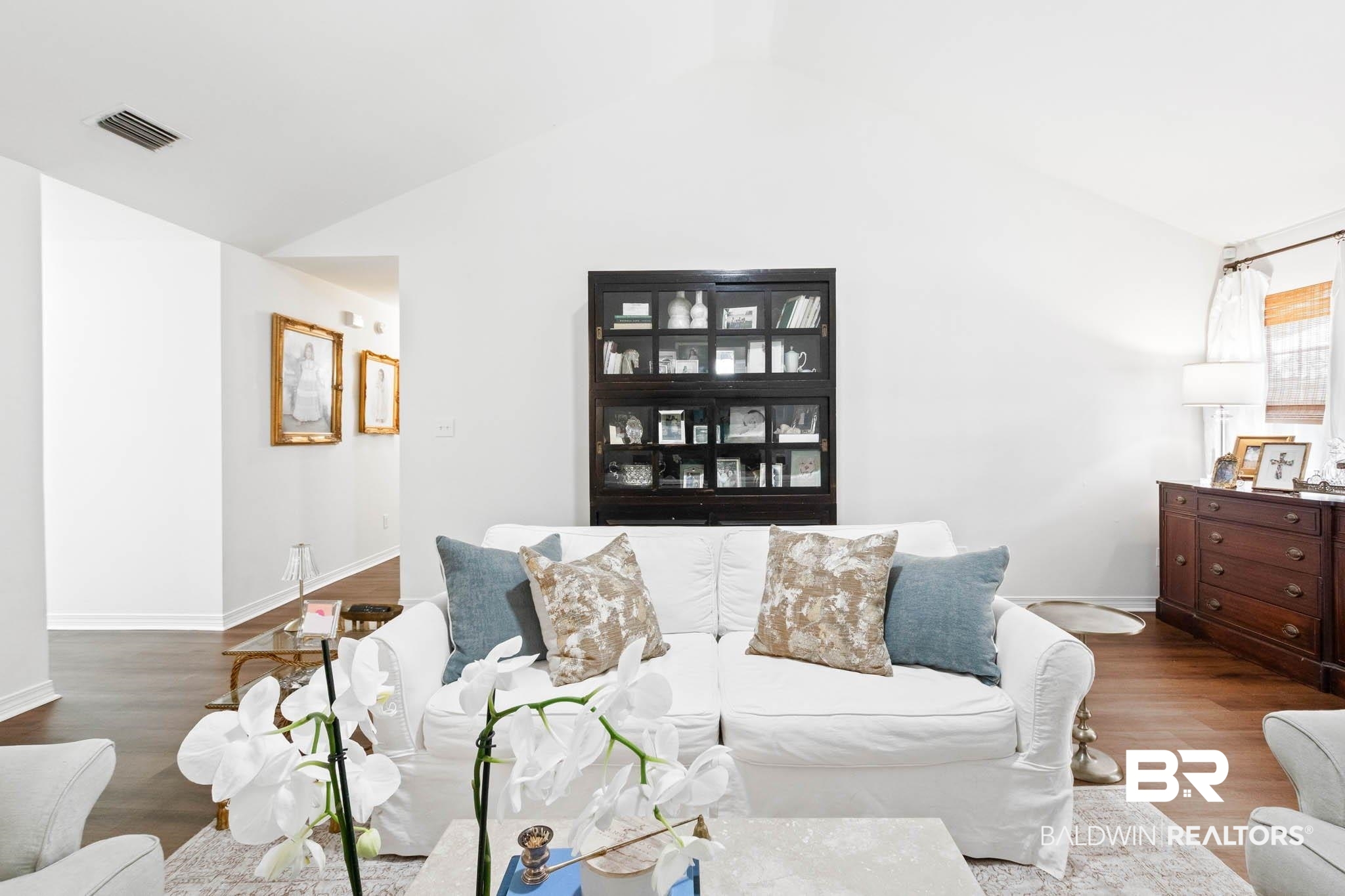 20685 Lowry Drive Fairhope, AL 36532 - Photo 11 of 48 Living area featuring wood finished floors and lofted ceiling