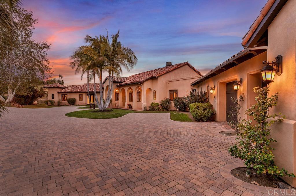 2864 Dos Lomas Fallbrook, CA 92028 - Photo 1 of 1 a view of a white house with a yard and potted plants