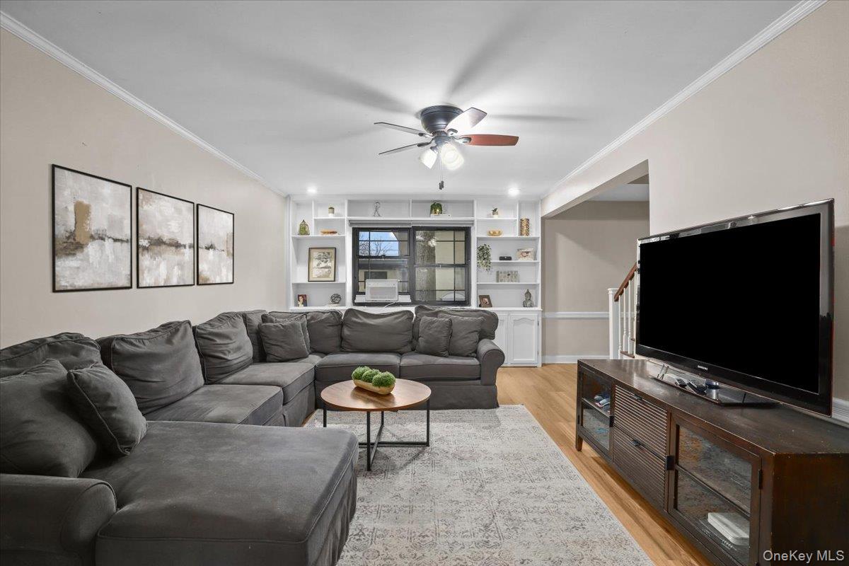 33 Manchester Road, Unit 2R Eastchester, NY 10709 - Photo 3 of 20 a living room with furniture and a flat screen tv