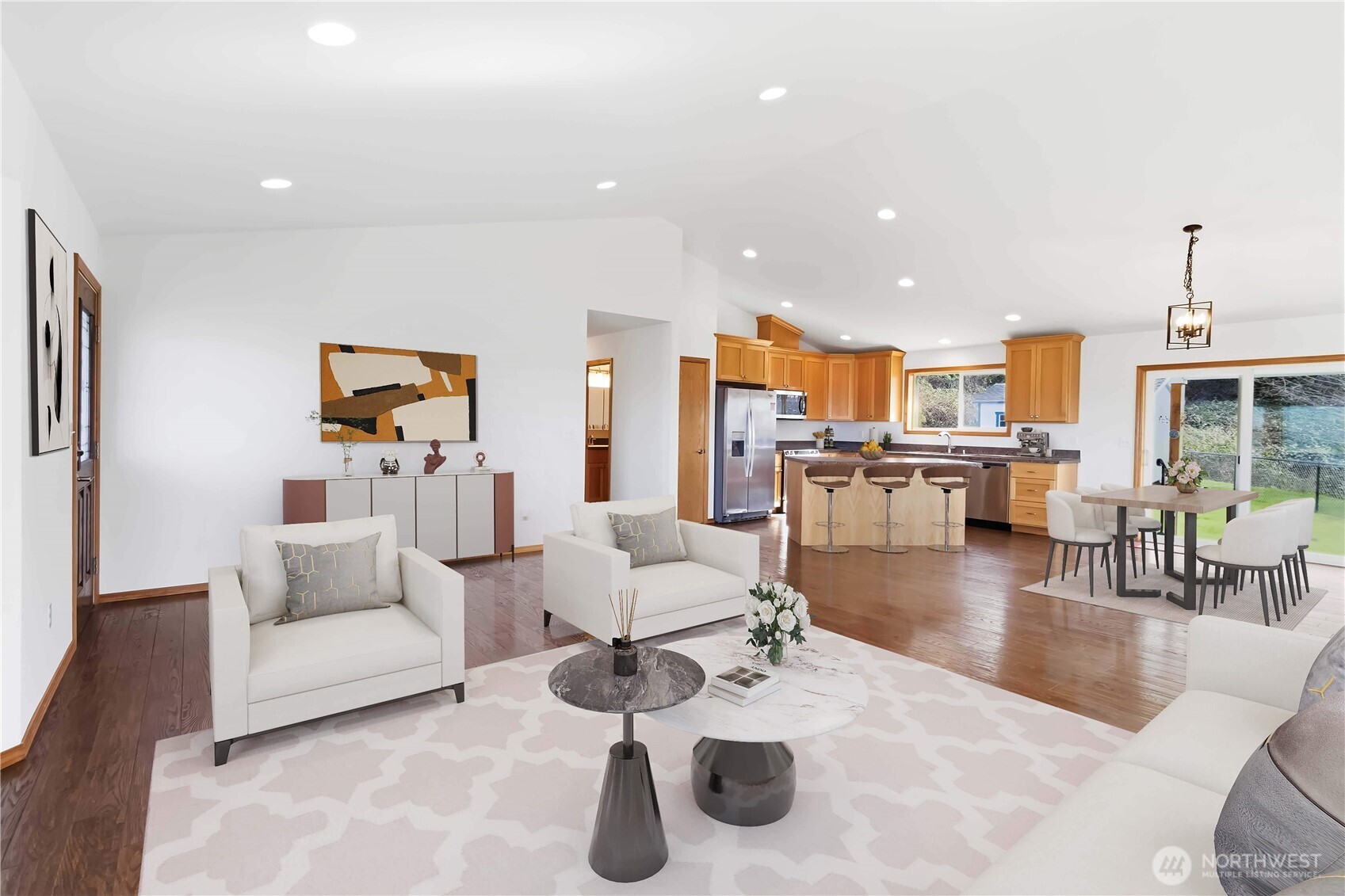 58 Alger Creek Heights Road Cathlamet, WA 98612 - Photo 11 of 40 a living room with furniture and a dining table with kitchen view