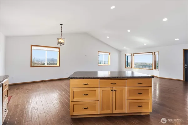 a living room with hard wood floors and a wooden floors