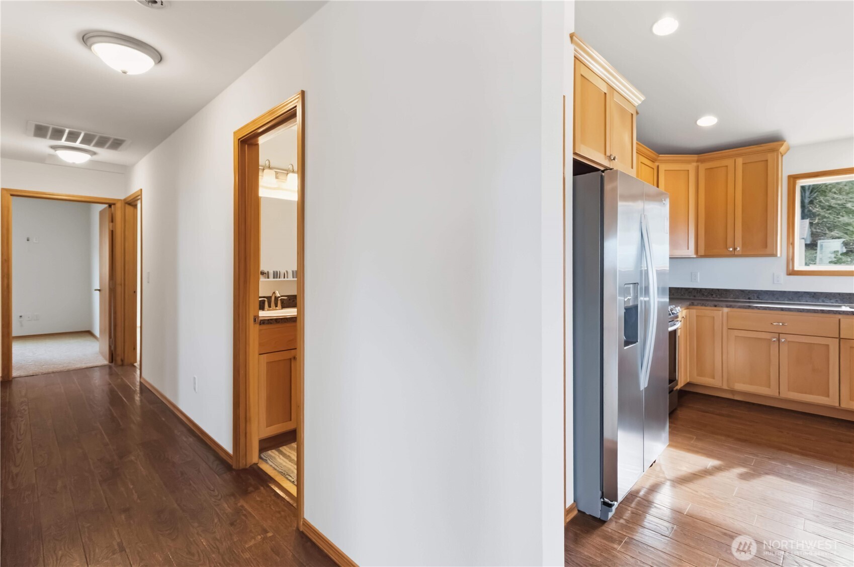 58 Alger Creek Heights Road Cathlamet, WA 98612 - Photo 17 of 40 a view of a kitchen with a refrigerator and a sink