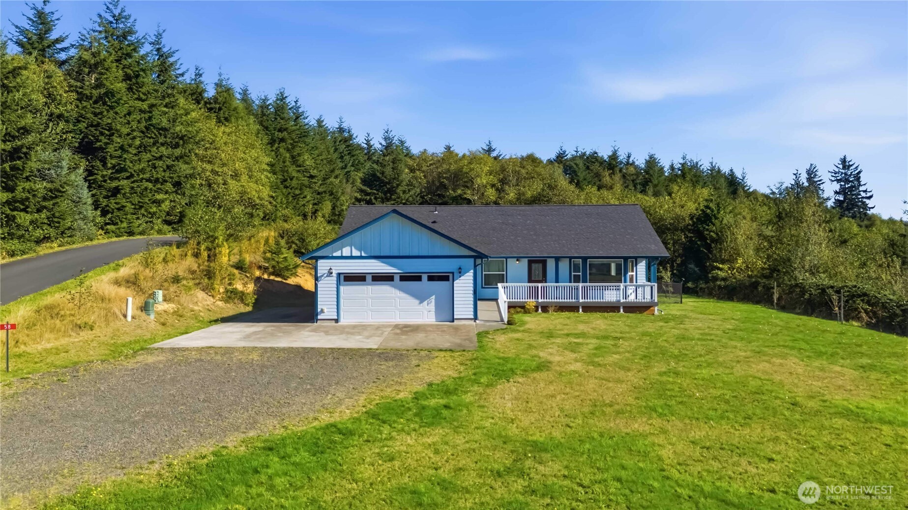 58 Alger Creek Heights Road Cathlamet, WA 98612 - Photo 2 of 40 a house view with a garden space