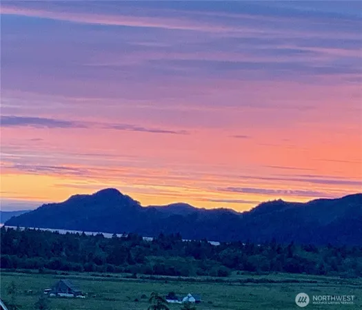 a view of mountain and sunset
