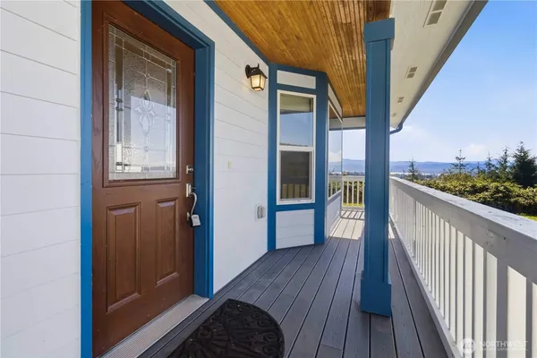 a view of a balcony with wooden floor