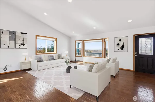 a living room with furniture and a large window