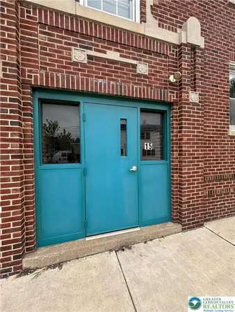 a front view of a house with parking space