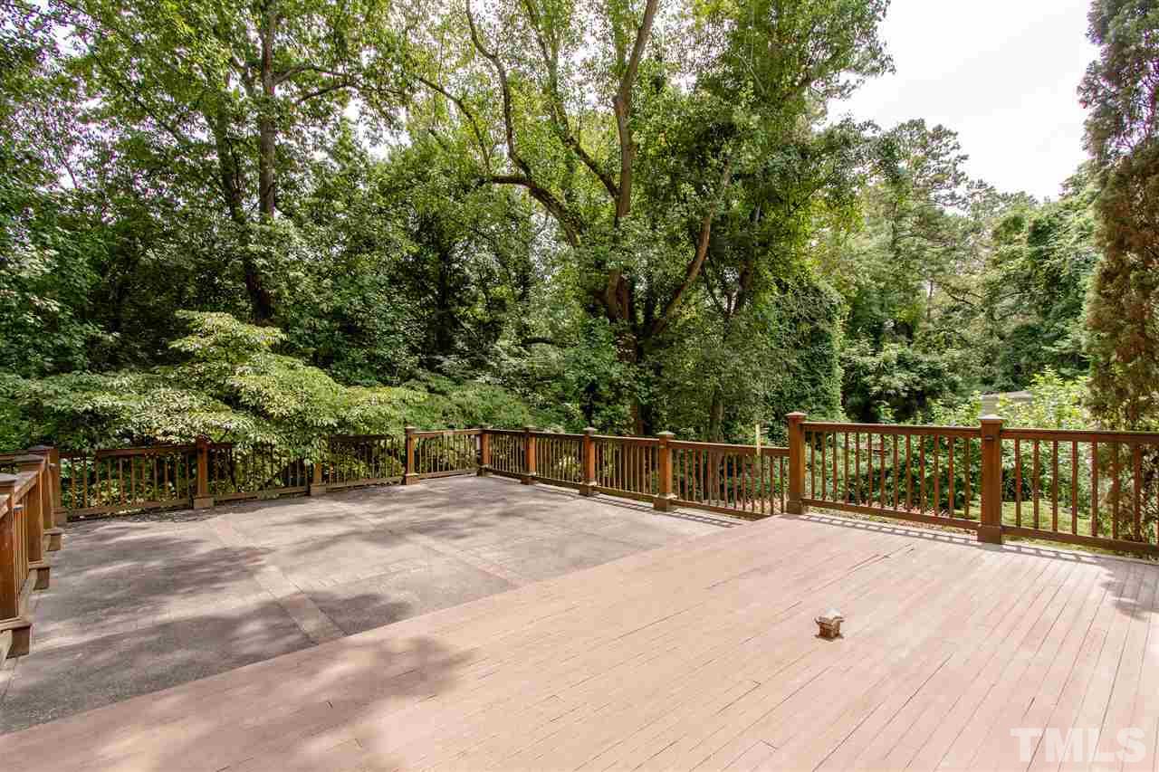 2726 Cambridge Road Raleigh, NC 27608 - Photo 14 of 25 a view of balcony with wooden fence