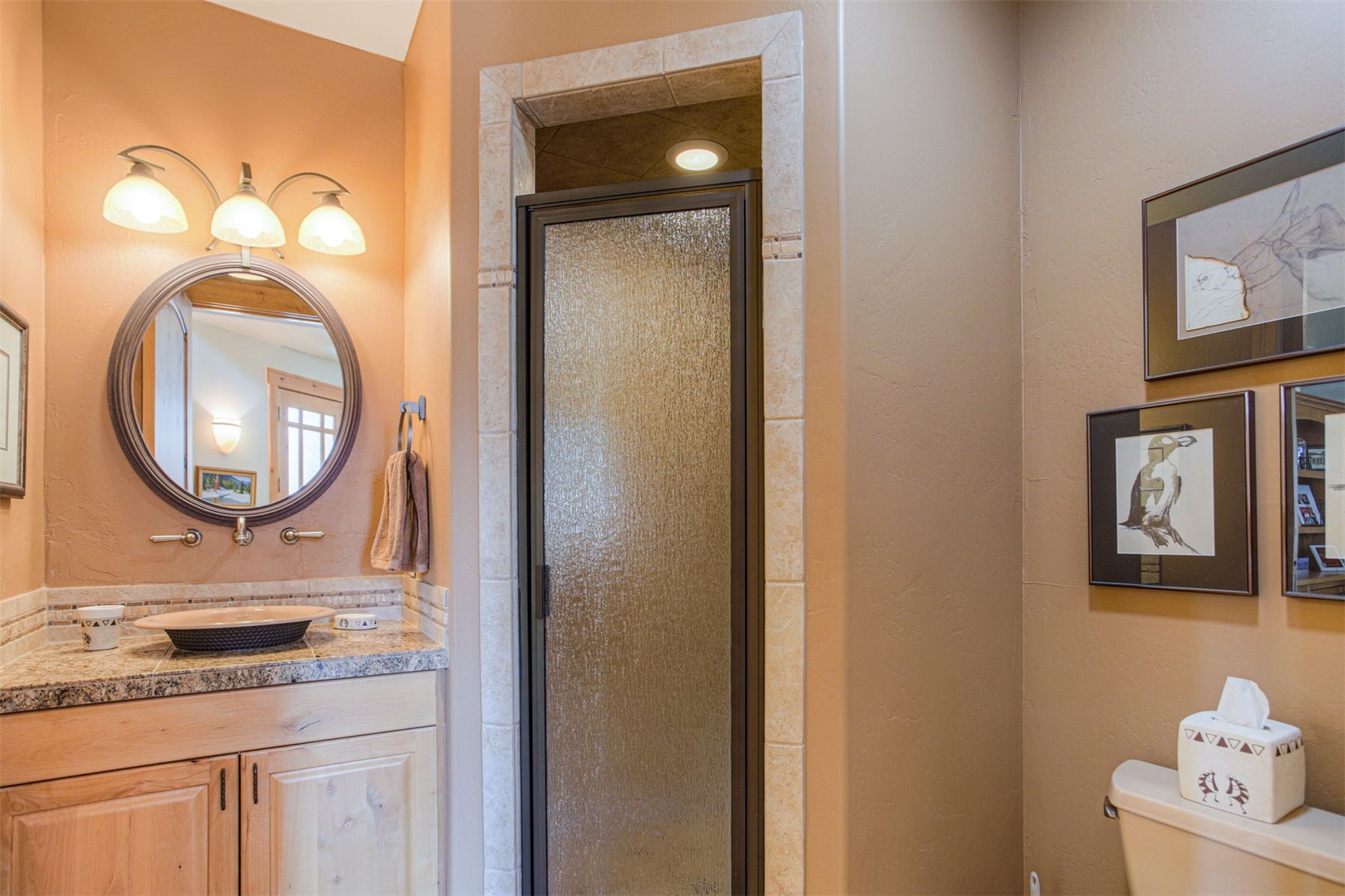 727 Willowbrook Road Silverthorne, CO 80498 - Photo 14 of 47 Bathroom featuring vanity, a shower stall, and a textured wall
