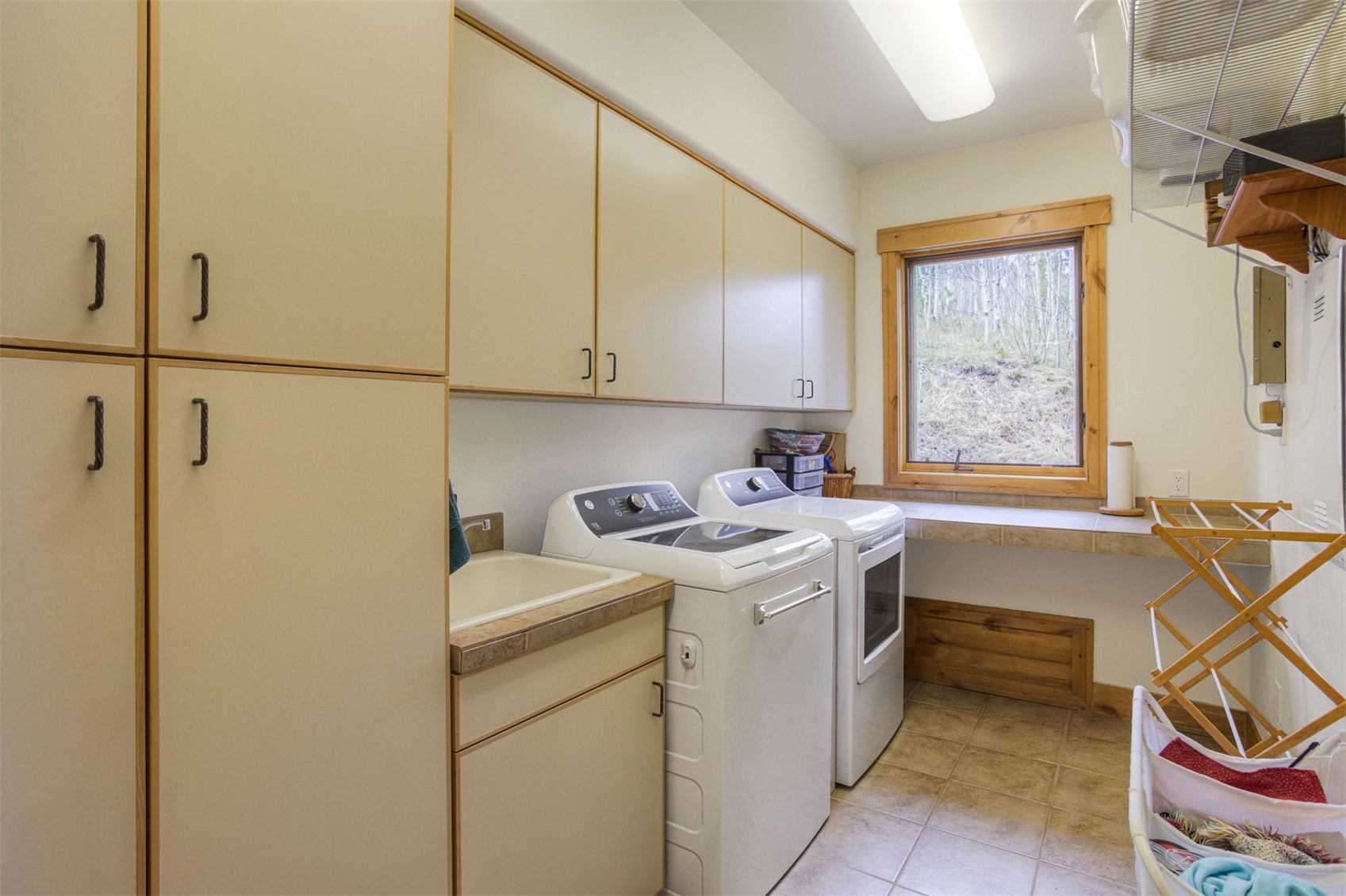 727 Willowbrook Road Silverthorne, CO 80498 - Photo 17 of 47 Large laundry room, wash sink, folding table and laundry chute from upper levels